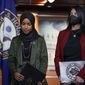 Rep. Ilhan Omar, D-Minn., left, joined by Rep. Rashida Tlaib, D-Mich., pauses before speaking to reporters in the wake of anti-Islamic comments made last week by Rep. Lauren Boebert, R-Colo., who likened Omar to a bomb-carrying terrorist, during a news conference at the Capitol in Washington, Tuesday, Nov. 30, 2021. (AP Photo/J. Scott Applewhite)