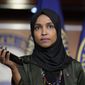 Rep. Ilhan Omar, D-Minn., plays a recording of a death threat left on her voicemail in the wake of anti-Islamic comments made last week by Rep. Lauren Boebert, R-Colo., who likened Omar to a bomb-carrying terrorist, during a news conference at the Capitol in Washington, Tuesday, Nov. 30, 2021. (AP Photo/J. Scott Applewhite) **FILE**