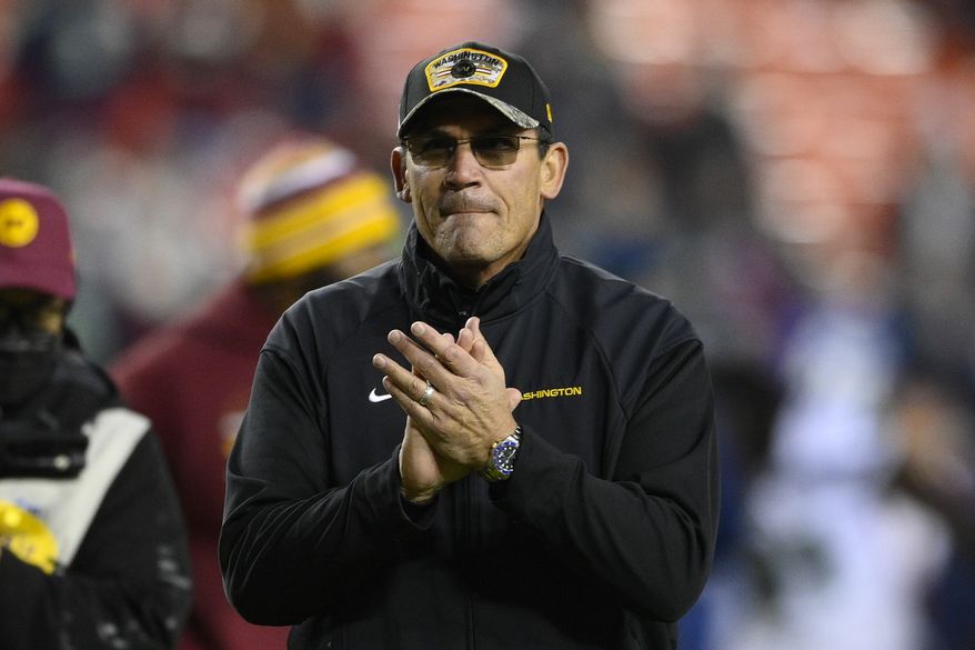 Washington Football Team head coach Ron Rivera claps his hands as he walks off the field following the end an NFL football game against the Seattle Seahawks, Monday, Nov. 29, 2021, in Landover, Md. Washington won 17-15. (AP Photo/Nick Wass)
