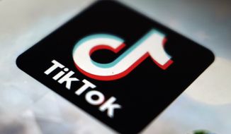 The TikTok app logo appears in Tokyo on Sept. 28, 2020. A well-known judge in Romania has been suspended from his position over videos he posted on the social media platform TikTok, a move that has drawn widespread criticism and condemnation from the U.S. Embassy on Tuesday. (AP Photo/Kiichiro Sato, File)