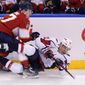 Florida Panthers center Frank Vatrano and Washington Capitals defenseman Martin Fehervary (42) battle for the puck during the second period of an NHL hockey game, Tuesday, Nov. 30, 2021, in Sunrise, Fla. (AP Photo/Wilfredo Lee) **FILE **