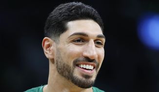 FILE - Boston Celtics&#39; Enes Kanter smiles before an NBA basketball game against the Toronto Raptors, on Oct. 22, 2021, in Boston. The Celtics center changed his name from Enes Kanter, to Enes Kanter Freedom, in celebration of him officially becoming a United States citizen on Monday, Nov. 29, 2021.  (AP Photo/Michael Dwyer, File)