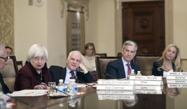 FILE - Federal Reserve Board Chair Janet Yellen, second from left, oversees an open meeting of the board with board members; Vice Chair Stanley Fischer, Yellen, Daniel Tarullo, Jerome Powell, and Lael Brainard, in Washington, Thursday, Dec. 15, 2016. President Joe Biden announced Monday, Nov. 22, 2021 that he’s nominating Powell for a second term as Federal Reserve chair, endorsing his stewardship of the economy through a brutal pandemic recession in which the Fed’s ultra-low rate policies helped bolster confidence and revitalize the job market. Biden also said he would nominate Brainard, the lone Democrat on the Fed’s Board of Governors and the preferred alternative to Powell for many progressives, as Vice Chair. (AP Photo/Cliff Owen, File)