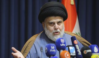 FILE - Populist Shiite cleric Muqtada al-Sadr, speaks during a press conference in Najaf, Iraq, Nov. 18, 2021. The final results announced by Iraq’s electoral commission on Tuesday, Nov. 30, 2021, confirmed al-Sadr as the biggest winner in last month&#39;s vote, securing 73 out of Parliament’s 329 seats. The results also confirmed that pro-Iran factions — which had alleged voter fraud — lost around two-thirds of their seats in the Oct. 10 elections. (AP Photo/Anmar Khalil, File)