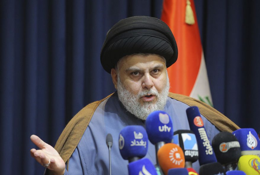 FILE - Populist Shiite cleric Muqtada al-Sadr, speaks during a press conference in Najaf, Iraq, Nov. 18, 2021. The final results announced by Iraq’s electoral commission on Tuesday, Nov. 30, 2021, confirmed al-Sadr as the biggest winner in last month&#x27;s vote, securing 73 out of Parliament’s 329 seats. The results also confirmed that pro-Iran factions — which had alleged voter fraud — lost around two-thirds of their seats in the Oct. 10 elections. (AP Photo/Anmar Khalil, File)
