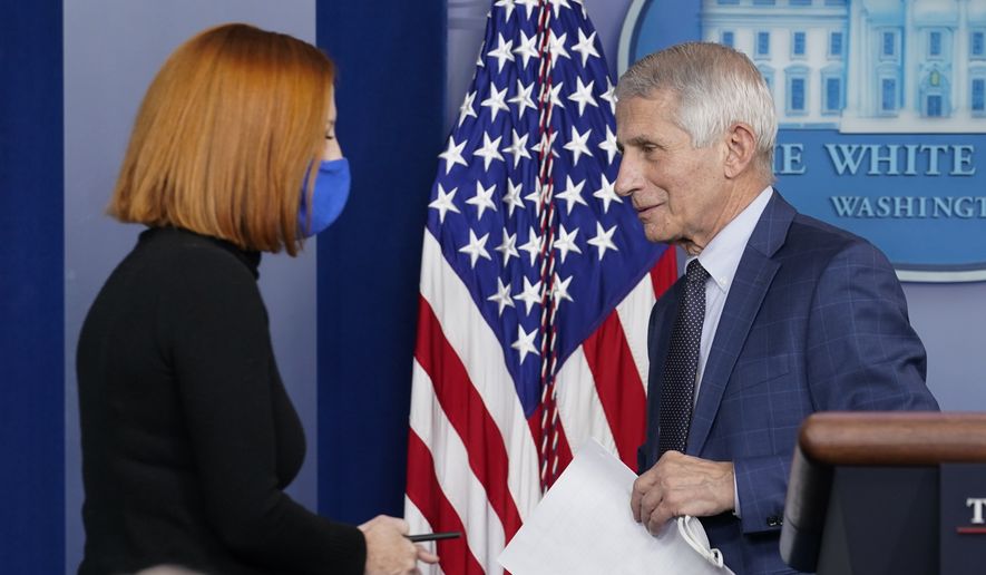 Then-White House press secretary Jen Psaki walks to the podium as Dr. Anthony Fauci, director of the National Institute of Allergy and Infectious Diseases, departs after speaking about the COVID-19 variant named omicron during the daily briefing at the White House in Washington, Wednesday, Dec. 1, 2021. (AP Photo/Susan Walsh) ** FILE **