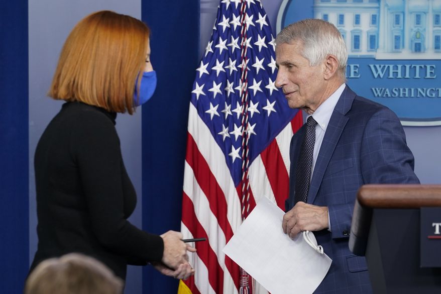 Then-White House press secretary Jen Psaki walks to the podium as Dr. Anthony Fauci, director of the National Institute of Allergy and Infectious Diseases, departs after speaking about the COVID-19 variant named omicron during the daily briefing at the White House in Washington, Wednesday, Dec. 1, 2021. (AP Photo/Susan Walsh) ** FILE **