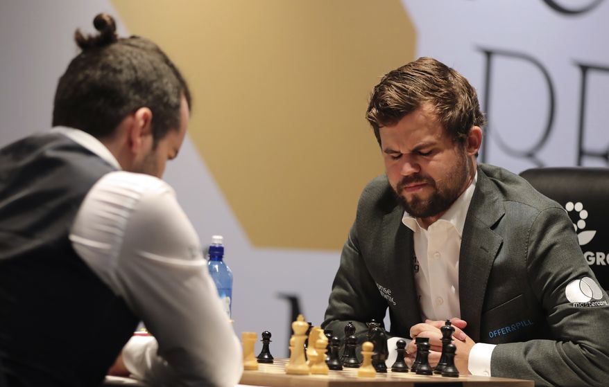 Norway&#39;s World Chess Champion Magnus Carlsen, reacts in game five against Ian Nepomniachtchi of Russia, during the FIDE World Championship at the Dubai Expo, in Dubai, United Arab Emirates, Wednesday, Dec. 1, 2021. (AP Photo/Kamran Jebreili)