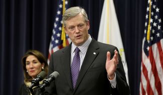 Massachusetts Republican Gov. Charlie Baker faces reporters as Mass. Lt. Gov. Karyn Polito (left) looks on during a news conference at the Statehouse, Jan. 25, 2017, in Boston. Baker announced Wednesday, Dec. 1, 2021, that he won&#39;t seek a third term as governor of Massachusetts. (AP Photo/Steven Senne) **FILE**
