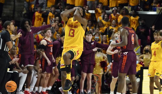 Maryland guard Hakim Hart reacts after a play against Virginia Tech during the second half of an NCAA college basketball game, Wednesday, Dec. 1, 2021, in College Park, Md. Virginia Tech won 62-58. (AP Photo/Julio Cortez)