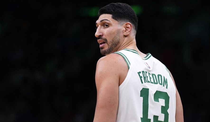 Boston Celtics center Enes Kanter Freedom looks toward the team&#39;s bench during the first half of an NBA basketball game Wednesday, Dec. 1, 2021, in Boston. The Boston Celtics center changed his name from Enes Kanter to Enes Kanter Freedom in celebration of him officially becoming a United States citizen Monday. (AP Photo/Charles Krupa)