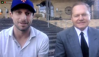 This still image from video shows New York Mets pitcher Max Scherzer, left, and agent Scott Boras as they participate in a news conference, Wednesday, Dec. 1, 2021. The Mets and the three-time Cy Young Award winner finalized a $130 million, three-year deal Wednesday, a contract that shattered baseball&#39;s record for highest average salary and forms a historically impressive 1-2 atop New York&#39;s rotation with Jacob deGrom. (AP Photo)
