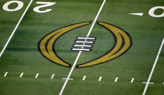 FILE - The College Football Playoff logo is shown on the field at AT&amp;amp;T Stadium before the Rose Bowl NCAA college football game between Notre Dame and Alabama in Arlington, Texas, Jan. 1, 2021. The most positive development at the latest meeting on expanding the College Football Playoff was that the people involved agreed to keep talking. There is no firm date for the next meeting, but there is one regularly schedule for January around the College Football Playoff championship game. (AP Photo/Roger Steinman, File)