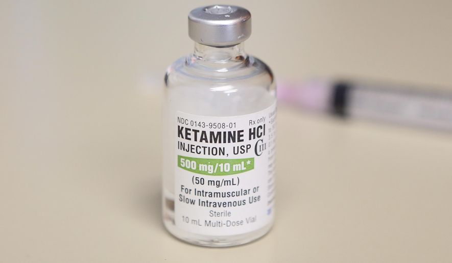 This photo shows a vial of ketamine, which is normally stored in a locked cabinet, July 25, 2018 in Chicago. Colorado's health department says emergency workers should not use a condition involving erratic behavior by people as a reason to inject them with the drug ketamine. Most states and ambulance agencies can use ketamine when people exhibit the condition called excited delirium. (AP Photo/Teresa Crawford, File)