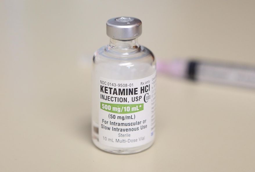 This photo shows a vial of ketamine, which is normally stored in a locked cabinet, July 25, 2018 in Chicago. Colorado's health department says emergency workers should not use a condition involving erratic behavior by people as a reason to inject them with the drug ketamine. Most states and ambulance agencies can use ketamine when people exhibit the condition called excited delirium. (AP Photo/Teresa Crawford, File)