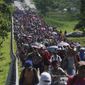Migrants arrive in Villa Comaltitlan, Chiapas state, Mexico, on Oct. 27, 2021, as they continue their journey through Mexico to the U.S. border. The Biden administration struck agreement with Mexico to reinstate a Trump-era border policy next week that forces asylum-seekers to wait in Mexico for hearings in U.S. immigration court, U.S. officials said Thursday. (AP Photo/Marco Ugarte, File)