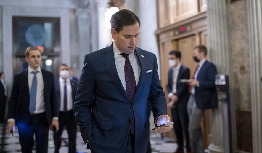 In this file photo, Sen. Marco Rubio, R-Fla., arrives to vote on an appropriations bill that funds the government through Feb. 18 and avoids a short-term shutdown after midnight Friday, at the Capitol in Washington, Thursday, Dec. 2, 2021.  (AP Photo/J. Scott Applewhite)  **FILE**
