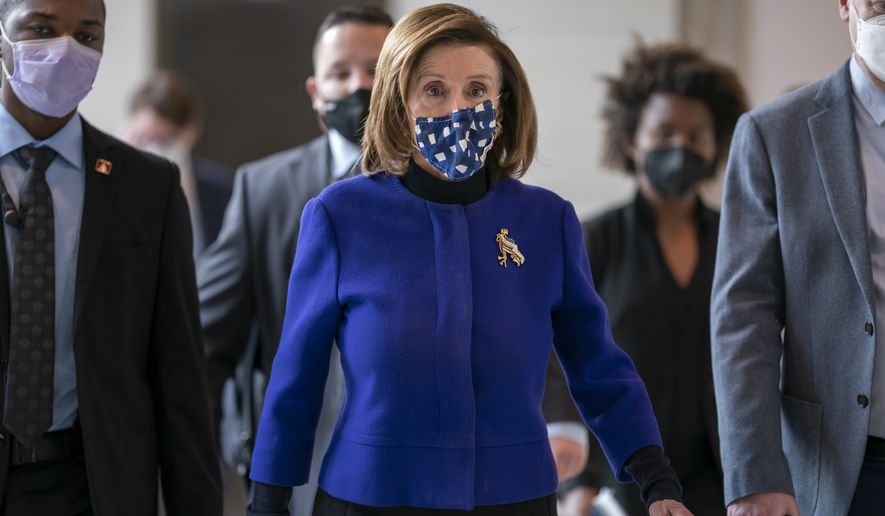 Speaker of the House Nancy Pelosi, D-Calif., arrives to update reporters on the must-pass priority of funding the government, during a news conference at the Capitol in Washington, Thursday, Dec. 2, 2021. (AP Photo/J. Scott Applewhite)