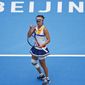 Peng Shuai of China reacts after scoring a point against Monica Niculescu of Romania during their women&#39;s singles match of the China Open tennis tournament at the Diamond Court in Beijing, Wednesday, Oct. 4, 2017. The head of the women’s professional tennis tour announced Wednesday, Dec. 1, 2021, that all WTA tournaments would be suspended in China because of concerns about the safety of Peng Shuai, a Grand Slam doubles champion who accused a former high-ranking government official in that country of sexual assault.(AP Photo/Andy Wong, File) **FILE**