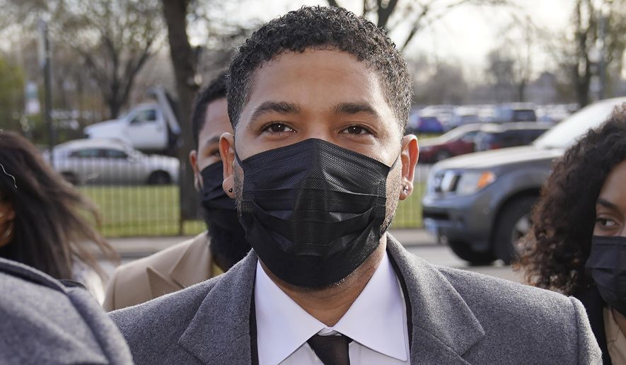 Actor Jussie Smollett arrives Thursday, Dec. 2, 2021, at the Leighton Criminal Courthouse on day four of his trial in Chicago. Smollett is accused of lying to police when he reported he was the victim of a racist, anti-gay attack in downtown Chicago nearly three years ago. (AP Photo/Charles Rex Arbogast)
