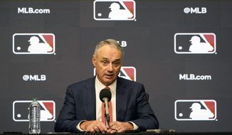 Major League Baseball commissioner Rob Manfred speaks during a news conference in Arlington, Texas, Thursday, Dec. 2, 2021. Owners locked out players at 12:01 a.m. Thursday following the expiration of the sport&#39;s five-year collective bargaining agreement. (AP Photo/LM Otero)