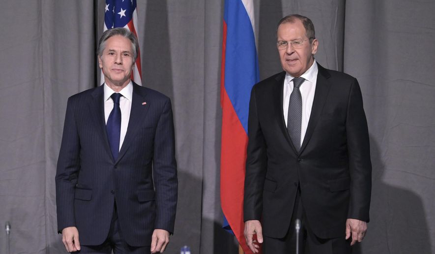 U.S. Secretary of State Antony Blinken, left, and Russian Foreign Minister Sergey Lavrov pose for photographers on the occasion of their meeting on the sidelines of an Organization for Security and Co-operation in Europe (OSCE) meeting, in Stockholm, Sweden, Thursday, Dec. 2, 2021. (Jonathan Nackstrand/Pool Photo via AP)