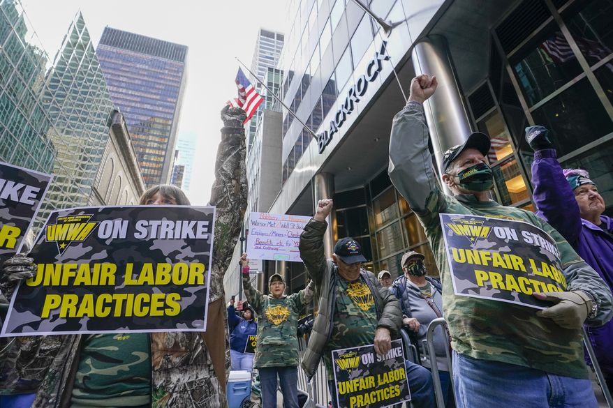 Members and supporters of the of the United Mine Workers of America demonstrate outside BlackRock headquarters, Thursday, Nov. 4, 2021, in New York. BlackRock is the largest shareholder of the Warrior Met Coal Inc. where union members have been on strike for nearly eight months seeking a contract that provides fair wages, affordable healthcare and reasonable rest and time-off for its workers. (AP Photo/Mary Altaffer)