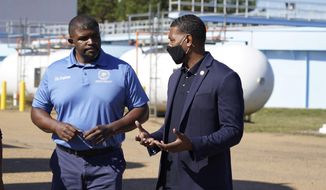 EPA Administrator Michael Regan, right, confers with city engineer Charles Williams at the O.B. Curtis Water Treatment Plant, a Ridgeland based facility near Jackson, Miss., about longstanding water issues that have plagued the city, Monday, Nov. 15, 2021. The visit was one of several stops in a weeklong &amp;quot;Journey to Justice&amp;quot; tour through Mississippi, Louisiana, and Texas, spotlighting longstanding environmental concerns in historically marginalized communities. (AP Photo/Rogelio V. Solis)