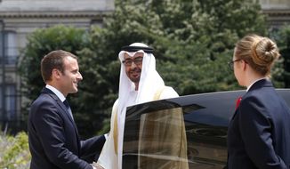 France&#x27;s President Emmanuel Macron, left, shakes hand with Crown Prince of Abu Dhabi and Deputy Supreme Commander of the UAE Armed Forces Sheikh Mohammed bin Zayed al-Nahayan, prior to a meeting, at the Elysee Palace, in Paris, Wednesday, June 21, 2017. Still reeling from the recent submarine deal rapture by Western allies, French President Emmanuel Macron is visiting the energy-rich Arab countries of the Persian Gulf on Friday, Dec. 3, 2021, with an aim to close a lucrative arms deal and strengthen France&#x27;s leadership role in renewed international efforts to revive Iran&#x27;s cratered nuclear deal with world powers. (AP Photo/Thibault Camus, File)