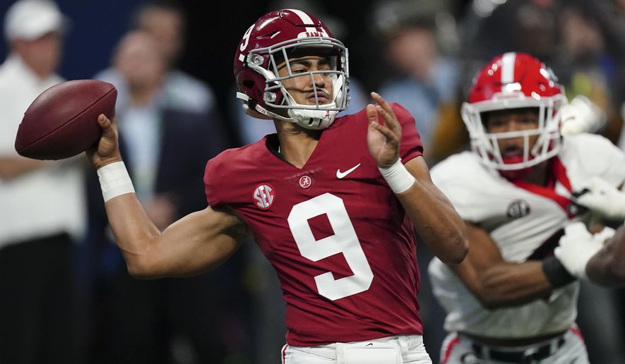 Alabama quarterback Bryce Young (9) passes in the pocket against Georgia during the first half of the Southeastern Conference championship NCAA college football game, Saturday, Dec. 4, 2021, in Atlanta. (AP Photo/John Bazemore)