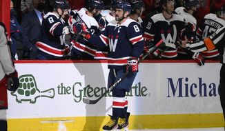Washington Capitals left wing Alex Ovechkin (8) celebrates his goal during the second period of an NHL hockey game against the Columbus Blue Jackets, Saturday, Dec. 4, 2021, in Washington. (AP Photo/Nick Wass)