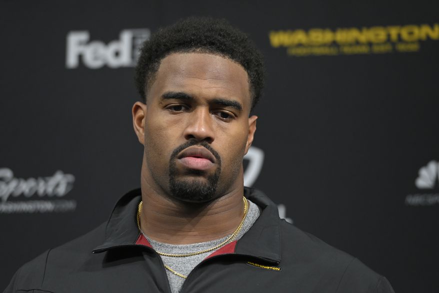 Washington Football Team defensive tackle Jonathan Allen (93) attends a news conference after an NFL football game against the Las Vegas Raiders, Sunday, Dec. 5, 2021, in Las Vegas. (AP Photo/David Becker)