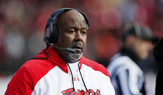 Maryland head coach Mike Locksley watches during the first half of an NCAA football game against Rutgers, Saturday, Nov. 27, 2021, in Piscataway, N.J. (AP Photo/Noah K. Murray)