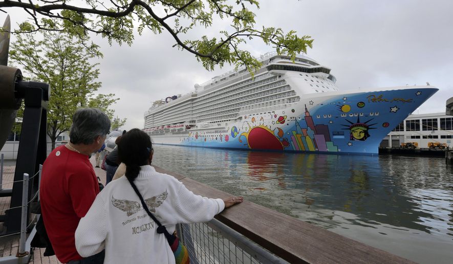FILE - People pause to look at Norwegian Cruise Line&#39;s ship, Norwegian Breakaway, on the Hudson River, in New York, on May 8, 2013. Ten people aboard the cruise ship, approaching New Orleans, have tested positive for COVID-19, officials said Saturday night, Dec. 4, 2021. The Norwegian Breakaway had departed New Orleans on Nov. 28 and is due to return this weekend, the Louisiana Department of Health said in a news release. Over the past week, the ship made stops in Belize, Honduras and Mexico. (AP Photo/Richard Drew, File)