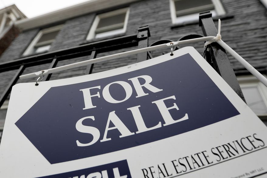 A sign is displayed outside a house for sale in Pittsburgh, Jan. 4, 2019. The Biden administration is looking to expand reporting requirements on all-cash real estate deals to help crack down on bad actors' use of the U.S. market to launder money made through illicit activity. (AP Photo/Keith Srakocic, File)
