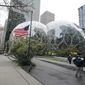 A U.S. flag flies in front of the Amazon Spheres on the company&#39;s corporate campus in downtown Seattle, Tuesday, Dec. 7, 2021. Amazon Web Services suffered a major outage Tuesday, the company said, disrupting access to many popular sites. The company provides cloud computing services to many governments, universities and companies, including The Associated Press. (AP Photo/Ted S. Warren)