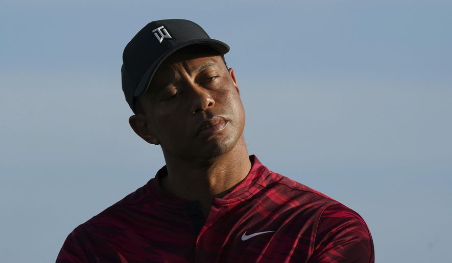 Tiger Woods gestures during the trophy ceremony of the Hero World Challenge PGA Tour at the Albany Golf Club, in New Providence, Bahamas, Sunday, Dec. 5, 2021.(AP Photo/Fernando Llano) **FILE**