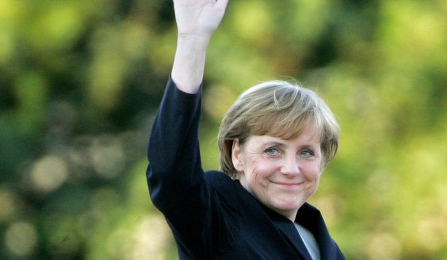 FILE - Angela Merkel arrives for a television debate with Chancellor Gerhard Schroeder at a television studio in Berlin, Sept. 4, 2005. As chancellor, Merkel has been credited with raising Germany’s profile and influence, helping hold a fractious European Union together, managing a string of crises and being a role model for women in a near-record tenure that ends with her leaving office amid praise from abroad and enduring popularity at home. Her designated successor Olaf Scholz is expected to take office Wednesday, Dec. 8, 2021. (AP Photo/Jockel Finck, File)