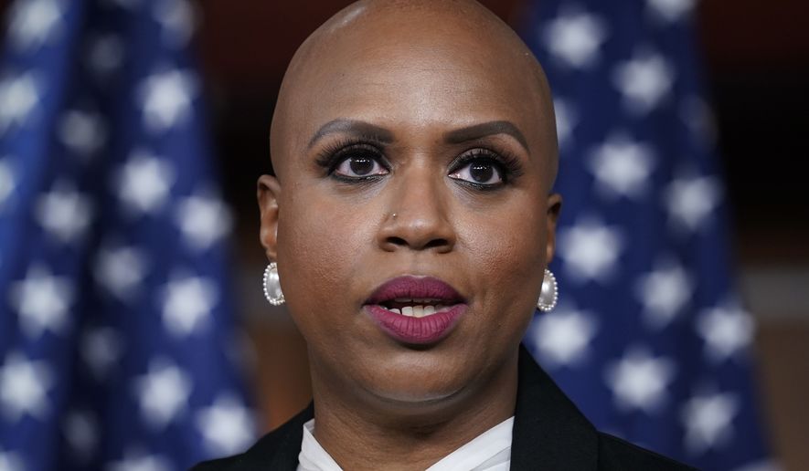 Rep. Ayanna Pressley, D-Mass., tells reporters she is introducing a resolution to strip Rep. Lauren Boebert, R-Colo., of her committee assignments for repeatedly making anti-Muslim remarks aimed at Rep. Ilhan Omar, D-Minn., at the Capitol in Washington, Wednesday, Dec. 8, 2021. (AP Photo/J. Scott Applewhite)