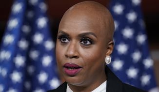 Rep. Ayanna Pressley, D-Mass., tells reporters she is introducing a resolution to strip Rep. Lauren Boebert, R-Colo., of her committee assignments for repeatedly making anti-Muslim remarks aimed at Rep. Ilhan Omar, D-Minn., at the Capitol in Washington, Wednesday, Dec. 8, 2021. (AP Photo/J. Scott Applewhite) **FILE**