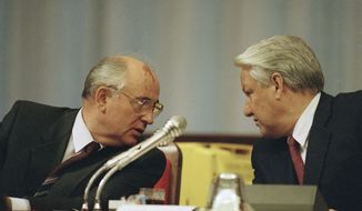 Soviet President Mikhail Gorbachev, left, and Russian Federation President Boris Yeltsin confer during a meeting of the Congress of People&#39;s Deputies on Monday, Sept. 2, 1991, in Moscow, Russia. Gorbachev said Yeltsin was a driving force behind the collapse of the Soviet Union. (AP Photo/Alexander Zemlianichenko, File)