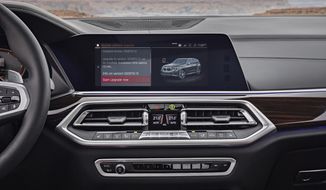 This photo provided by BMW is an example of a modern infotainment system that has multiple methods of input. Users can interact with the system via the touchscreen, control knob or buttons on the dashboard. (Courtesy of BMW via AP)