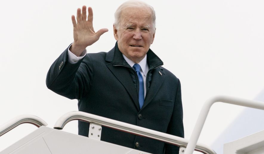 President Joe Biden waves as he boards Air Force One upon departure, Wednesday, Dec. 8, 2021, at Andrews Air Force Base, Md. Biden is en route to Kansas City, Mo. (AP Photo/Alex Brandon)