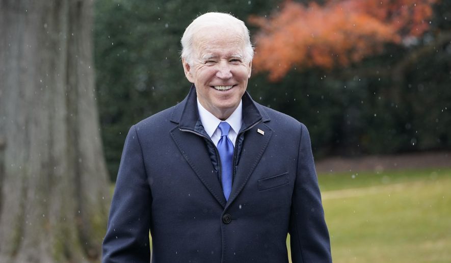 President Joe Biden talks with reporters at the White House in Washington, Wednesday, Dec. 8, 2021, during snow flurries, as heads to Missouri to promote the bipartisan infrastructure law. (AP Photo/Susan Walsh)