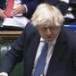 In this grab taken from video, Britain&#39;s Prime Minister Boris Johnson speaks during Prime Minister&#39;s Questions in the House of Commons, London, Wednesday, Dec. 8, 2021. Johnson says no U.K. government minister will attend the Beijing Olympics. Johnson on Wednesday called it “effectively” a diplomatic boycott. Johnson was asked in the House of Commons whether the U.K. will join the United States, Australia and Lithuania in a diplomatic boycott of the Winter Games. (House of Commons/PA via AP)