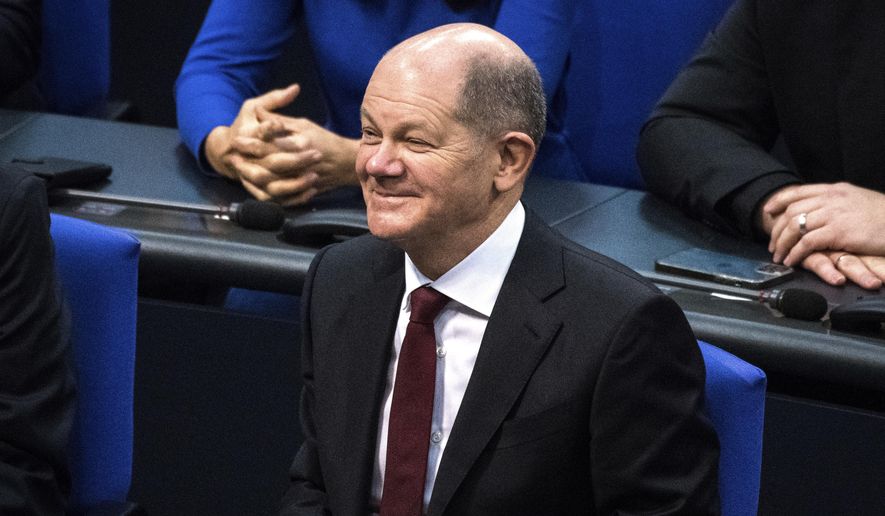 Olaf Scholz of the Social Democrats reacts after he was elected new German Chancellor in the German Parliament Bundestag in Berlin, Wednesday, Dec. 8, 2021. The election and swearing-in of the new Chancellor and the swearing-in of the federal ministers of the new federal government will take place in the Bundestag on Wednesday. (Photo/Stefanie Loos)