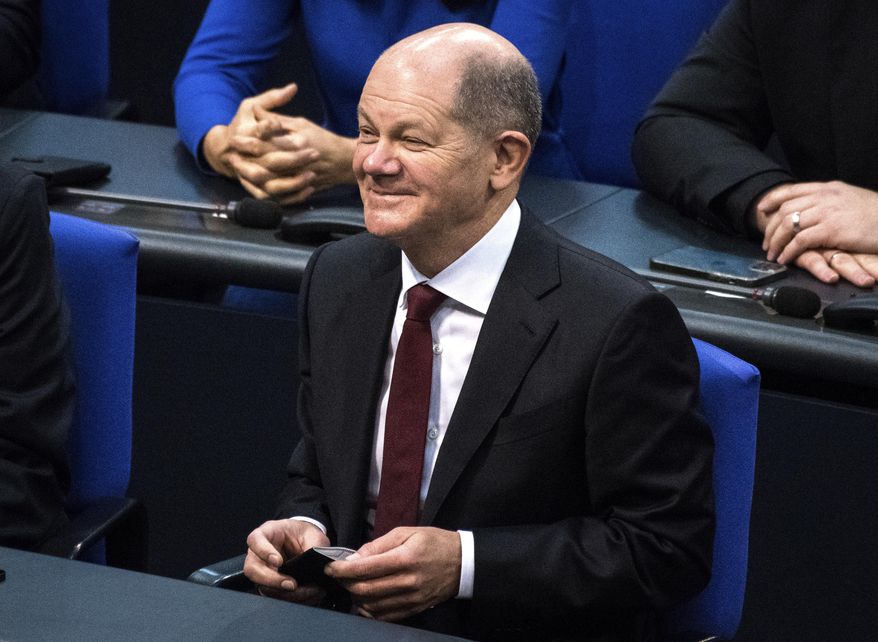 Olaf Scholz of the Social Democrats reacts after he was elected new German Chancellor in the German Parliament Bundestag in Berlin, Wednesday, Dec. 8, 2021. The election and swearing-in of the new Chancellor and the swearing-in of the federal ministers of the new federal government will take place in the Bundestag on Wednesday. (Photo/Stefanie Loos)