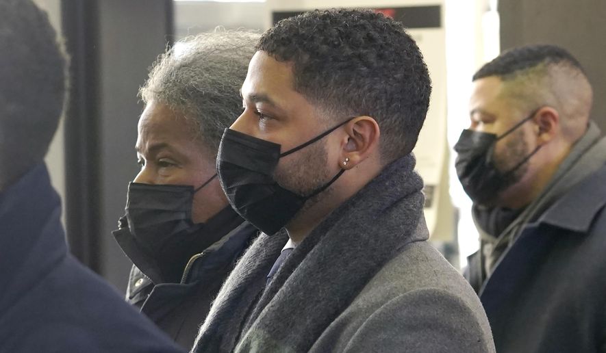 Actor Jussie Smollett arrives with his mother Janet at the Leighton Criminal Courthouse on Wednesday, Dec. 8, 2021, day seven of his trial in Chicago. (AP Photo/Charles Rex Arbogast)
