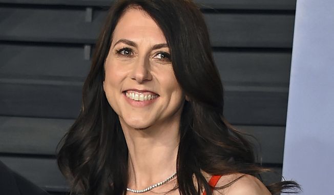 In this March 4, 2018, photo, then-MacKenzie Bezos arrives at the Vanity Fair Oscar Party in Beverly Hills, Calif. In a blog post on Wednesday, Dec. 8, 2021, titled “No Dollar Signs This Time,” billionaire philanthropist MacKenzie Scott said she won’t say how much she has given away to charity since her last round of donations in an effort to draw attention away from herself. (Photo by Evan Agostini/Invision/AP) **FILE**