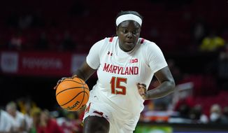 Maryland guard Ashley Owusu drives against Purdue during the first half of an NCAA college basketball game, Wednesday, Dec. 8, 2021, in College Park, Md. (AP Photo/Julio Cortez)